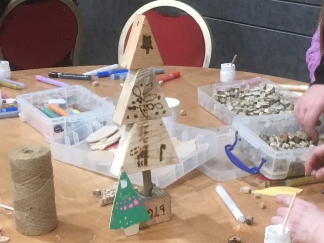 Christmas tree pyrography at Landfill Christmas celebration event